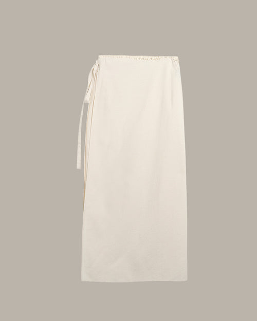 White skirt with a tie detail on a light gray background