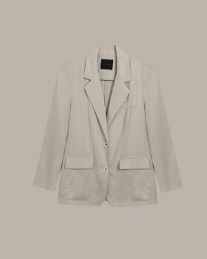 Apricot blazer on a beige background