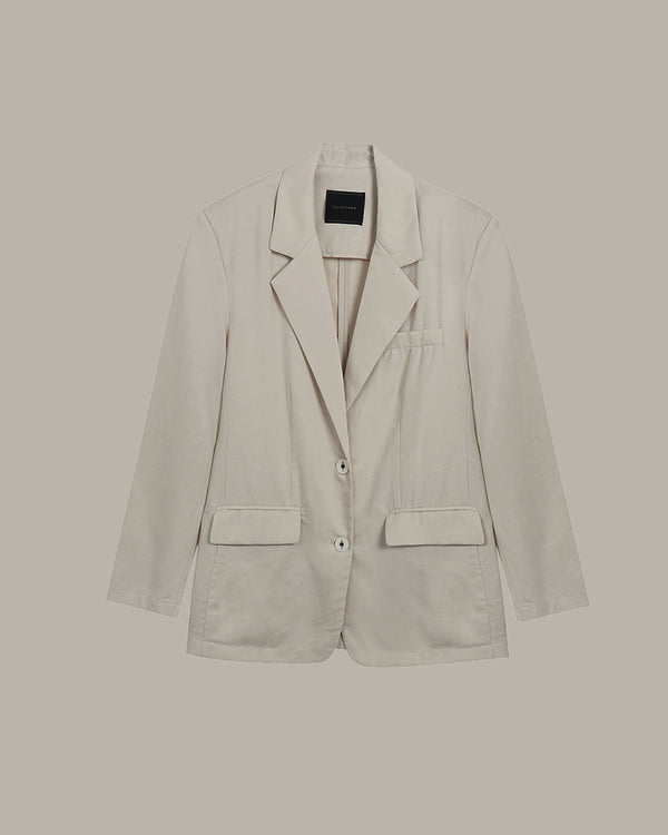 Apricot blazer on a beige background