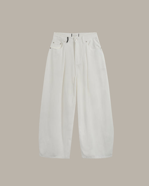 White wide-leg cropped pants with front pleats and belt loops, shown flat against a solid taupe background.