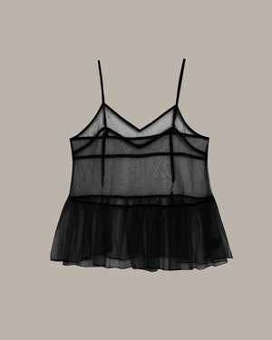 Black sheer camisole top on a beige background