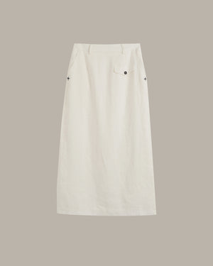 An off-white skirt with a single front patch pocket and small black embroidered star details on the sides, shown flat against a solid taupe background.