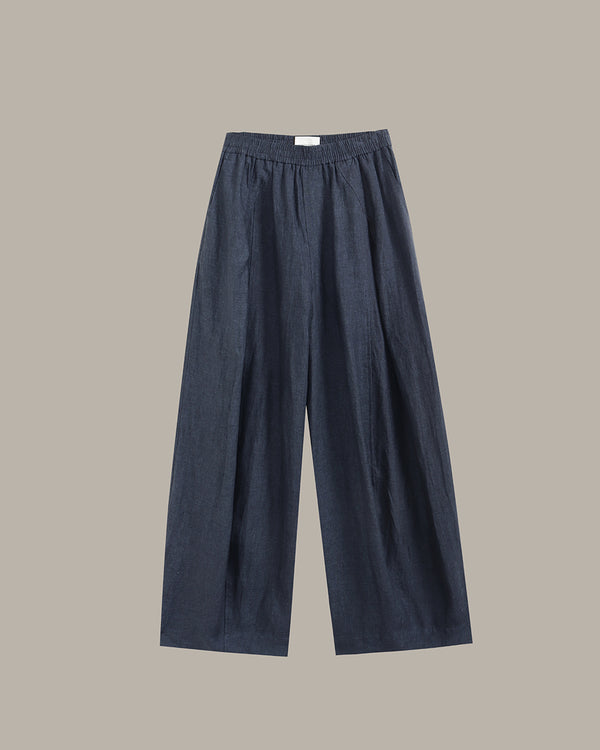navy wide-leg pants on a light gray background