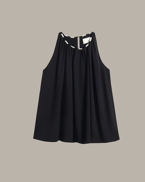 A black sleeveless top with a gathered, pleated front and a keyhole cutout at the neckline, shown flat against a solid taupe background.