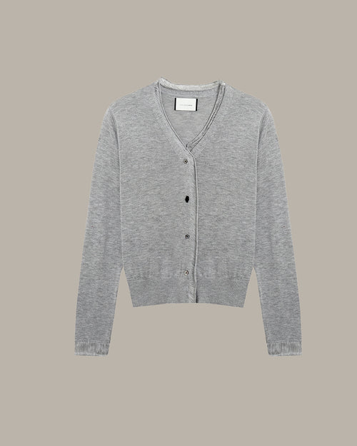 Gray cardigan on a beige background