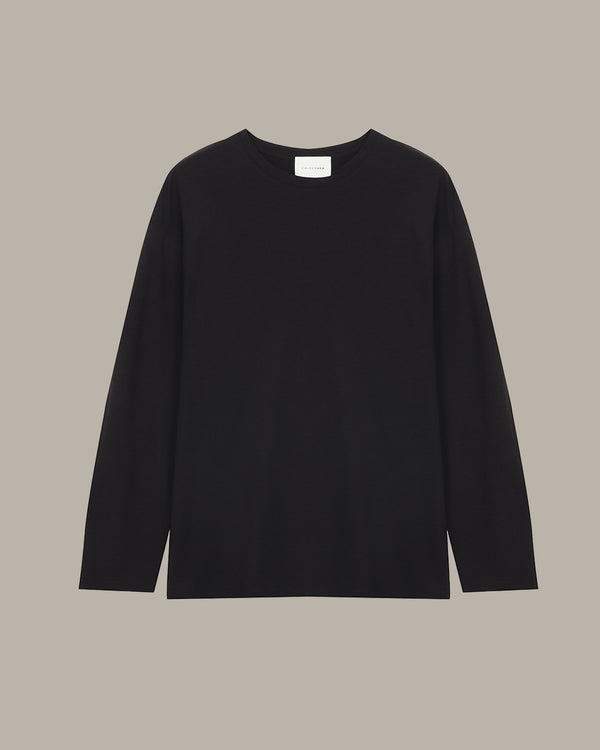 Black long-sleeve shirt on a beige background