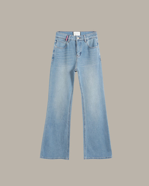 Light blue denim jeans with a straight-to-flare leg, shown flat against a solid taupe background.