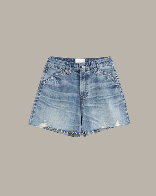 Light blue denim shorts with a distressed wash and raw frayed hems, shown flat on a solid taupe background.