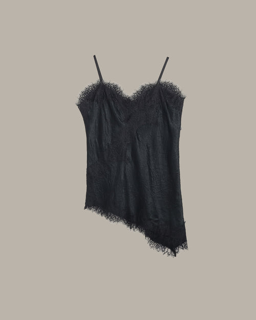Black lace camisole on a beige background