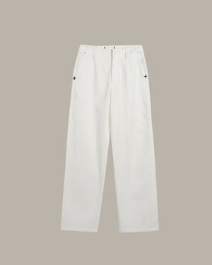 White pants on a beige background