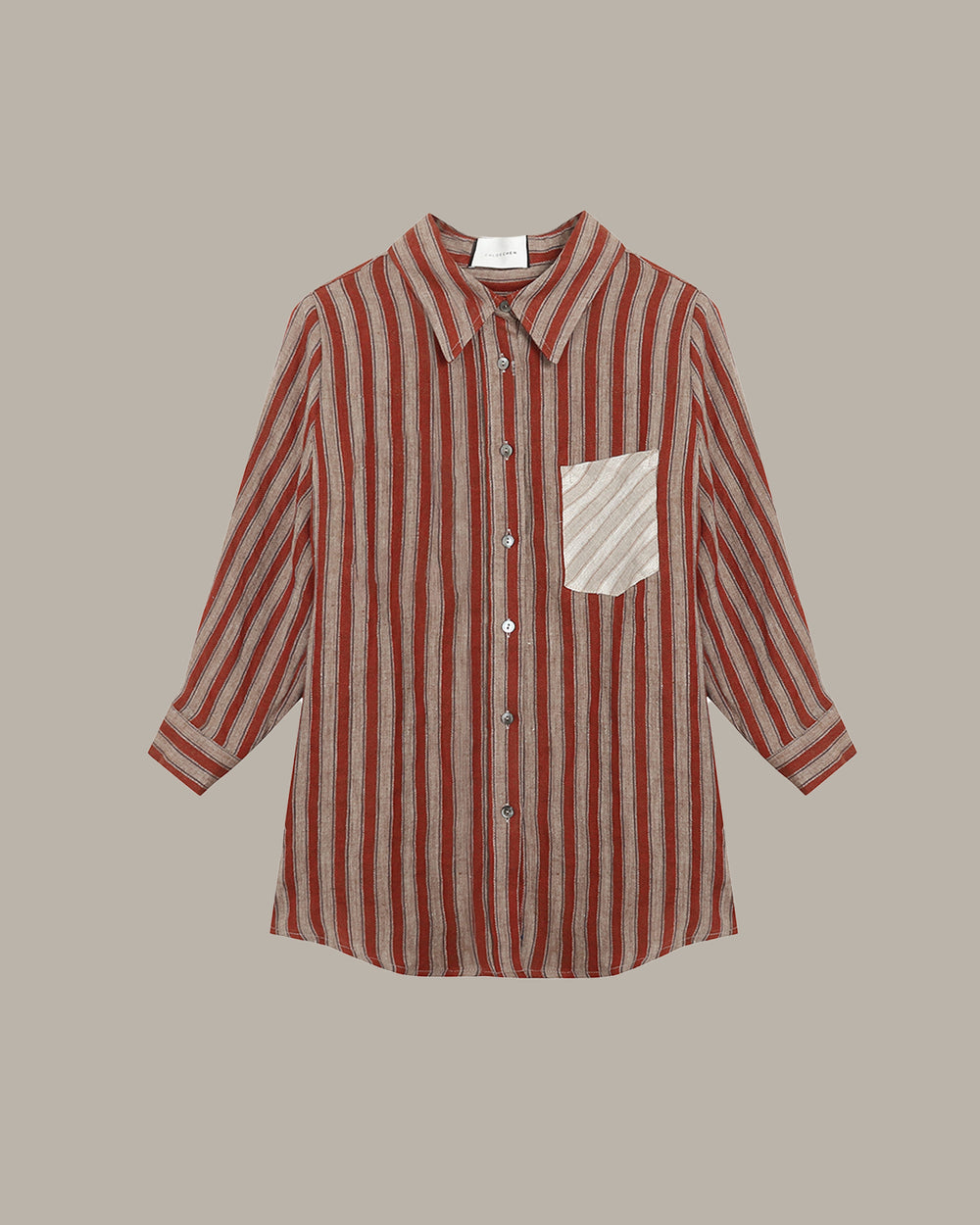 Red and white striped shirt with a pocket on a beige background