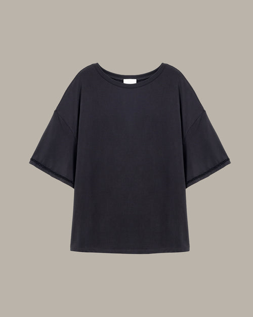 Black t-shirt on a beige background