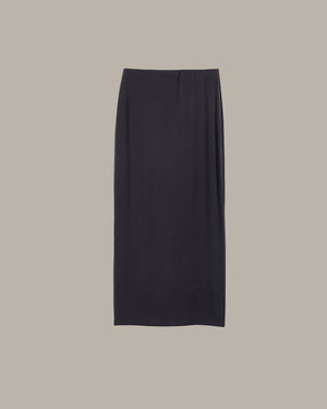 dark grey pencil skirt on a beige background