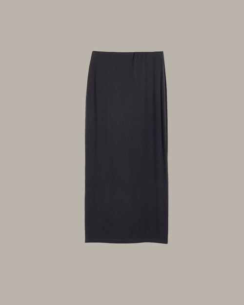 dark grey pencil skirt on a beige background