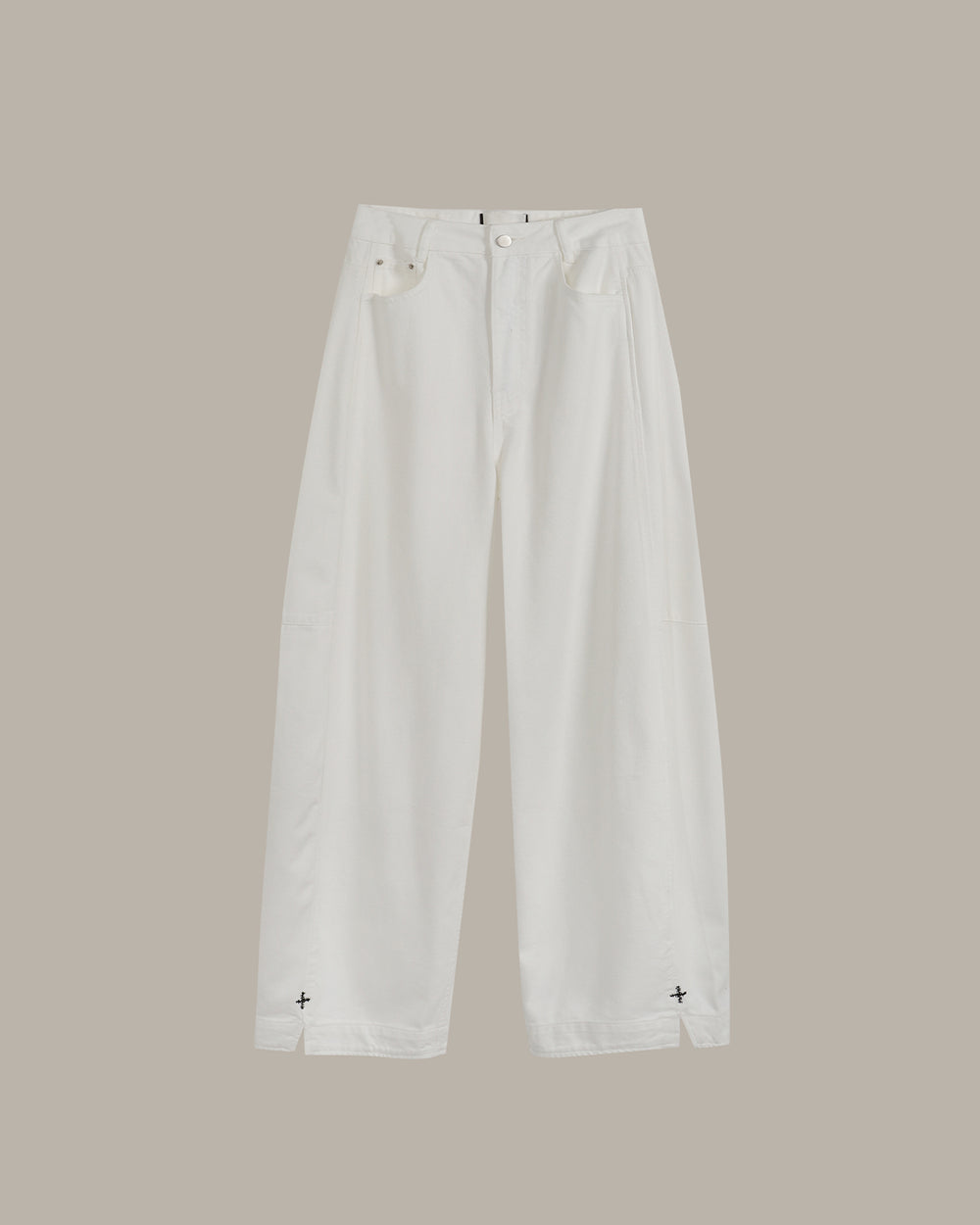 A pair of off-white barrel jeans with small black star details near the hem, displayed flat against a solid taupe background.