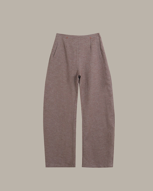 Brown pants on a beige background