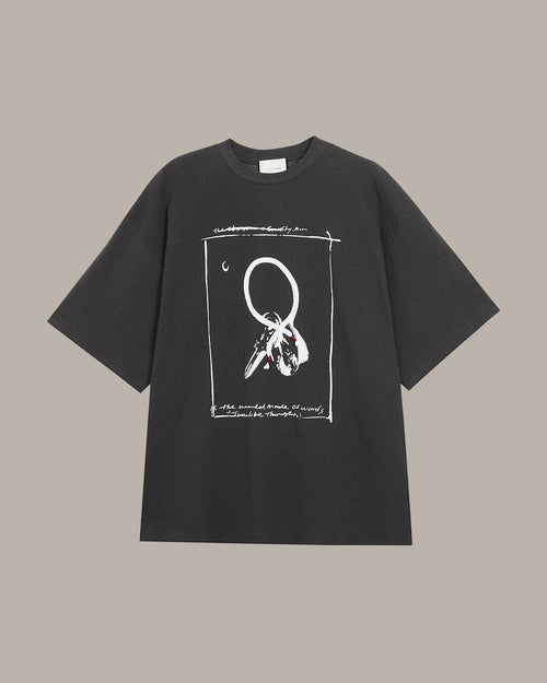 Dark grey t-shirt with white graphic design on a beige background