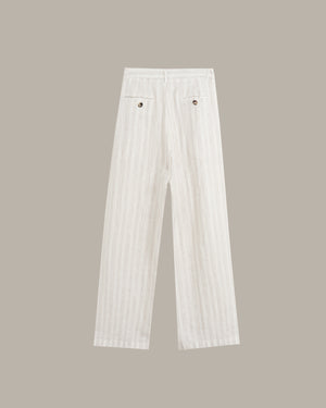White pinstriped trousers with a high waist and back pockets, shown flat against a solid taupe background.