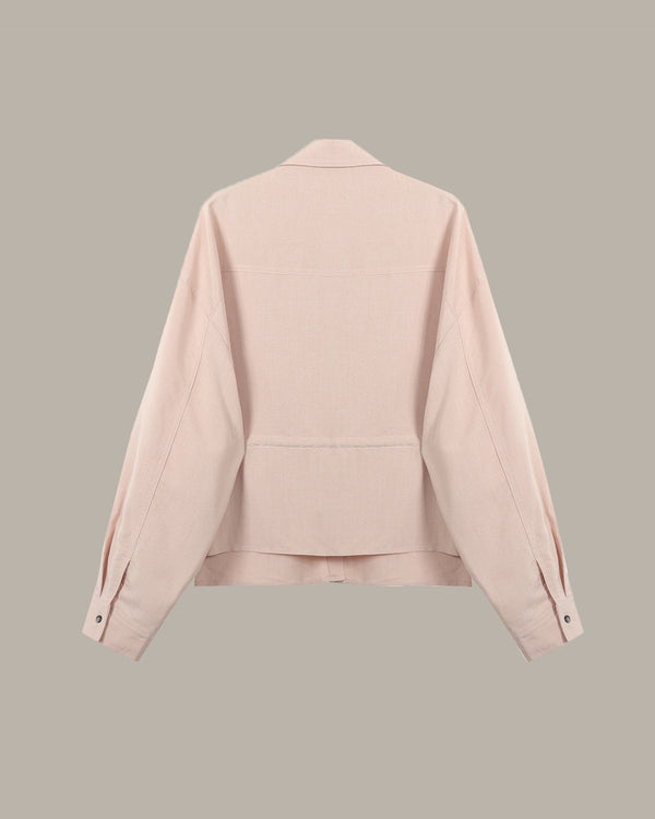 back of a Pink jacket on a beige background