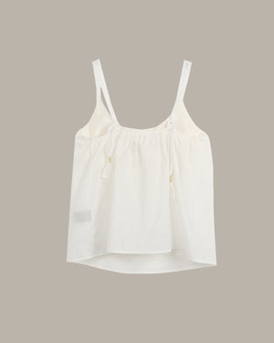 White tank top on a beige background