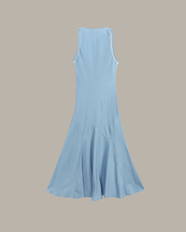 A light blue sleeveless midi dress with a flared skirt, shown from the back against a solid taupe background.