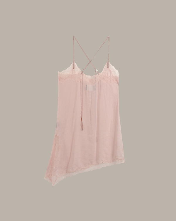 A light pink sheer camisole top with thin straps and a lace-trimmed neckline, shown hanging against a solid taupe-gray background.