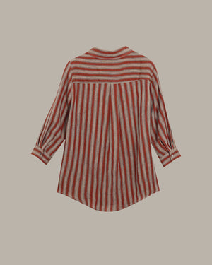 Red and white striped shirt on a beige background