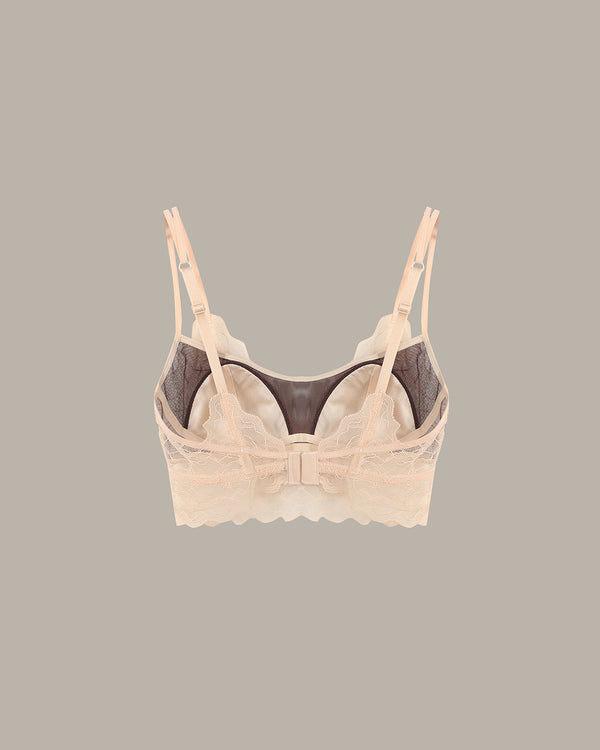 Beige bra with lace details on a gray background