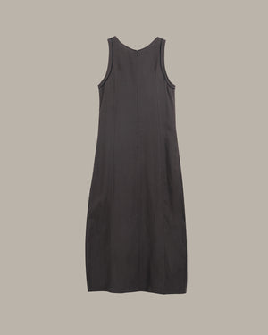Black sleeveless dress on a beige background