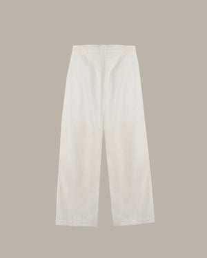 White pants on a beige background