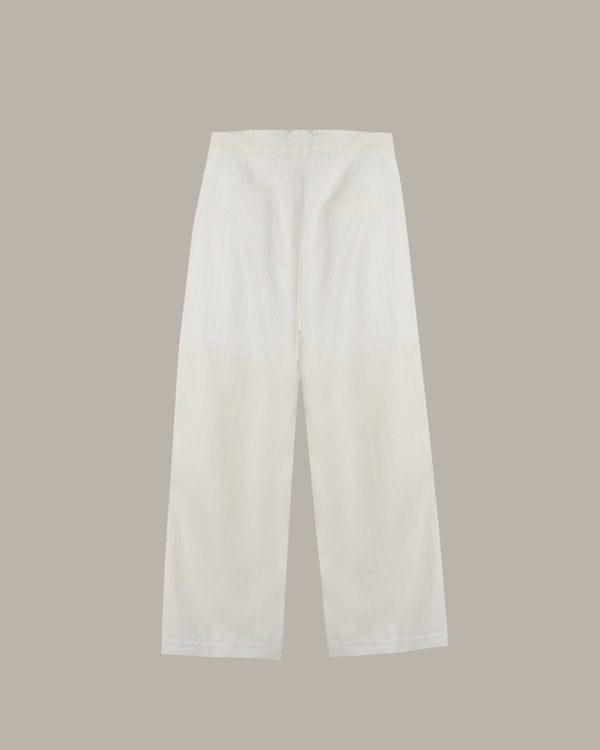 White pants on a beige background