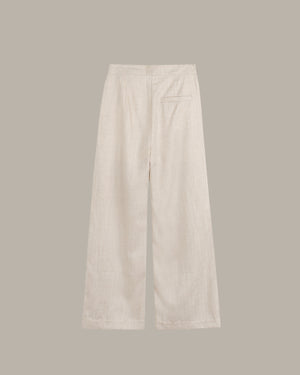 Beige pants on a light gray background