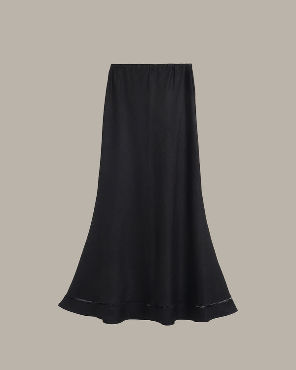 Black skirt on a beige background