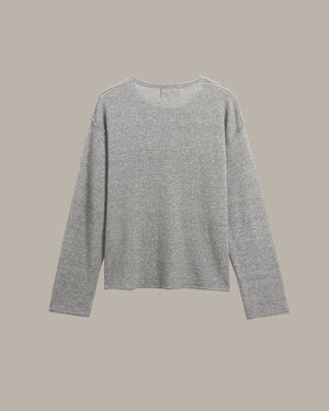 A light gray heathered knit long-sleeve top with a wide crew neckline, displayed flat against a solid taupe background.