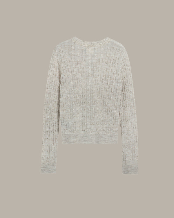 back of a khaki textured sweater on a beige background