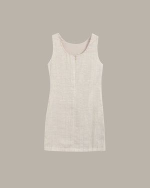 Light beige sleeveless dress on a plain background