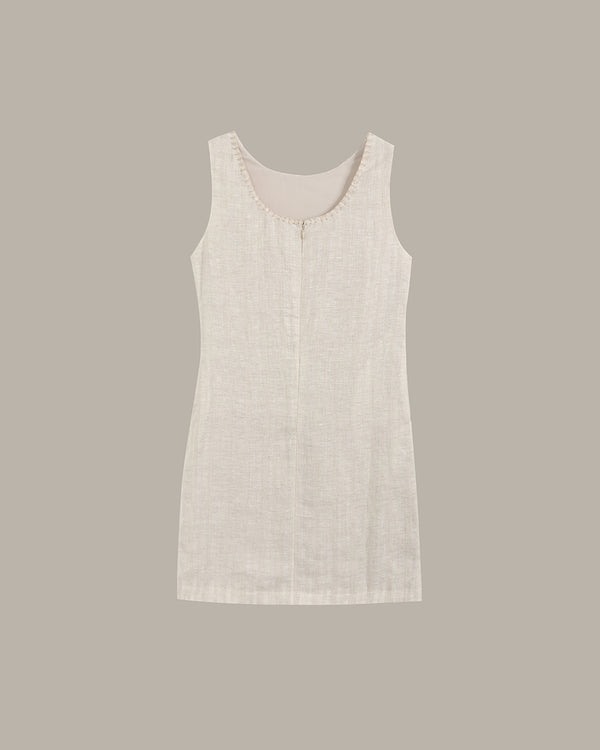 Light beige sleeveless dress on a plain background