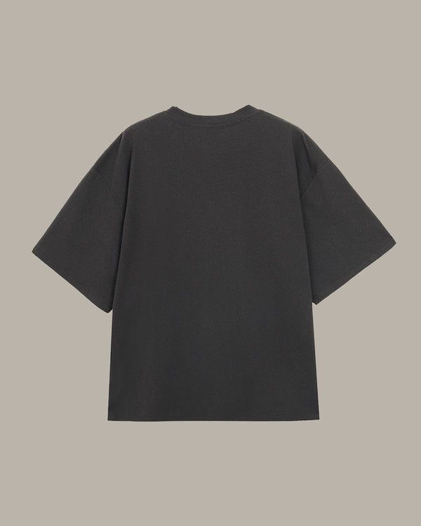 dark gray t-shirt on a beige background