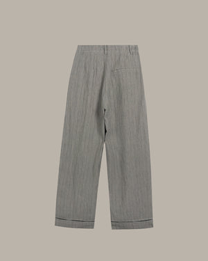 Gray striped pants on a beige background