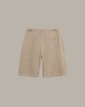 Beige linen shorts with a flat front, belt loops, and two side welt pockets, shown from the back against a solid taupe background.