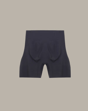 Black shorts on a beige background