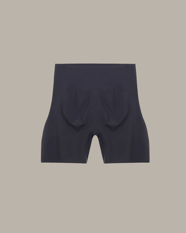 Black shorts on a beige background