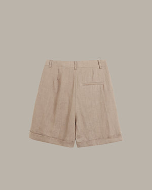 back of brown shorts on a beige background