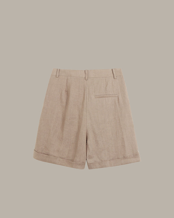 back of brown shorts on a beige background