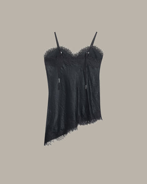Black lace camisole on a beige background
