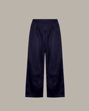 Navy blue wide-leg pants on a beige background