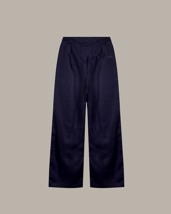 Navy blue wide-leg pants on a beige background