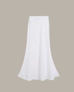 White skirt on a beige background