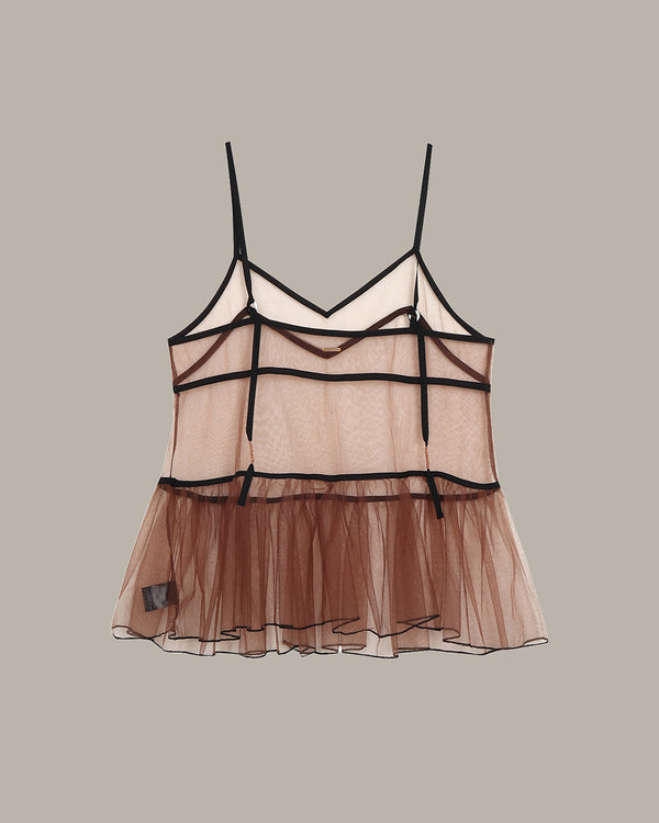 Sheer camisole with brown bottom and black straps on a beige background