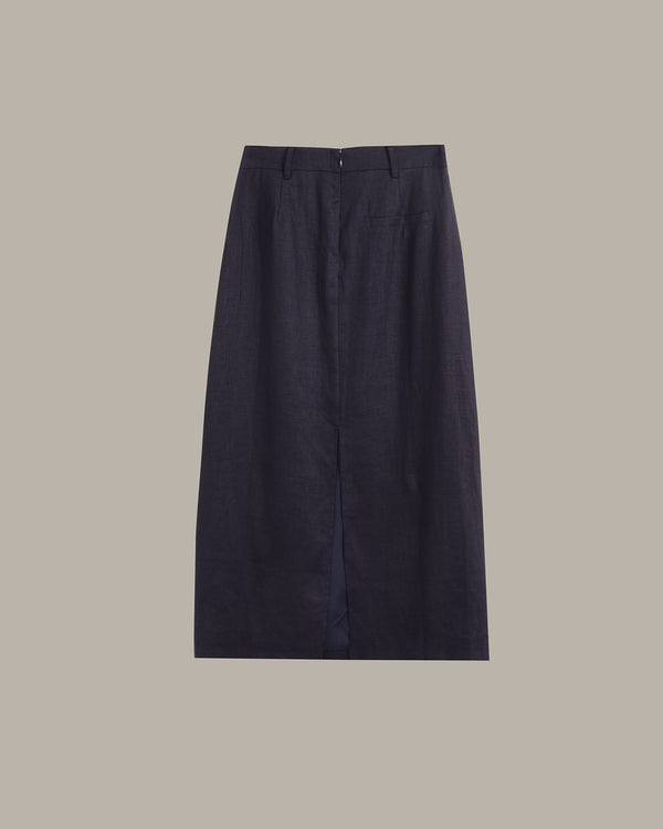 A dark navy blue high-waisted skirt with front pleats and belt loops, shown flat against a solid taupe background.